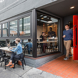 A man and a woman in a restaurant.