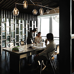 A group of people sitting at a table.