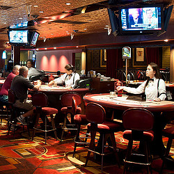 People sitting at tables in a restaurant.