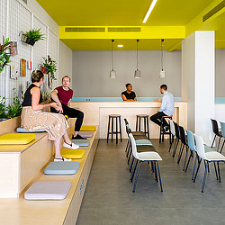 A group of people sitting on chairs.