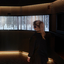 A person standing in front of a window.