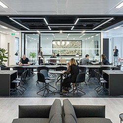 A group of people sitting at tables.