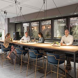 A group of people sitting at a table with food.
