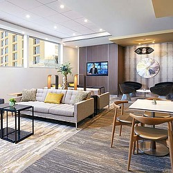 A living room with a couch and a tv.