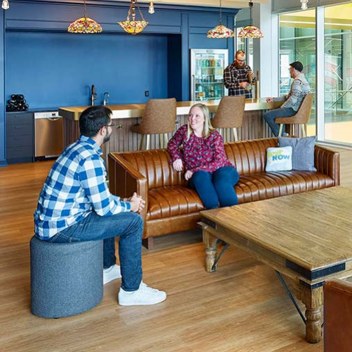 A man and a woman sitting on a couch.