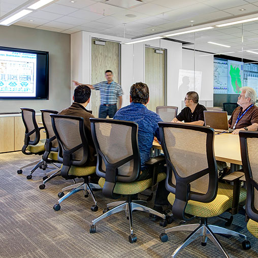 A group of people in a meeting.