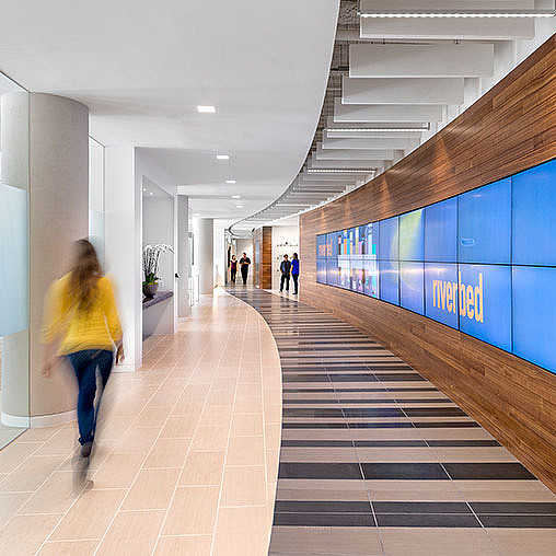 A person walking down a hallway.