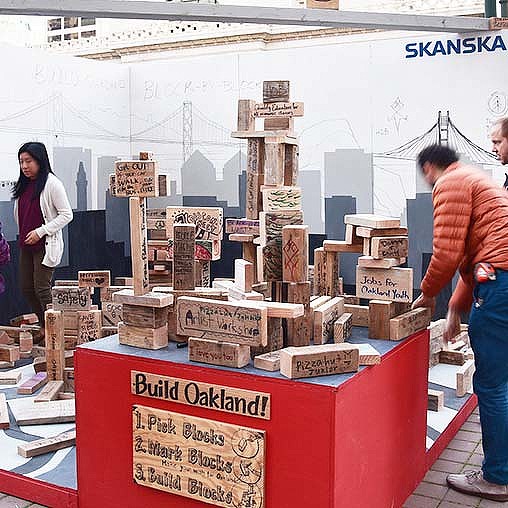 A man and woman standing next to a table with boxes on it.