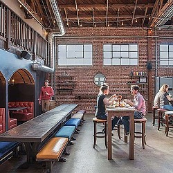People sitting at tables in a room.
