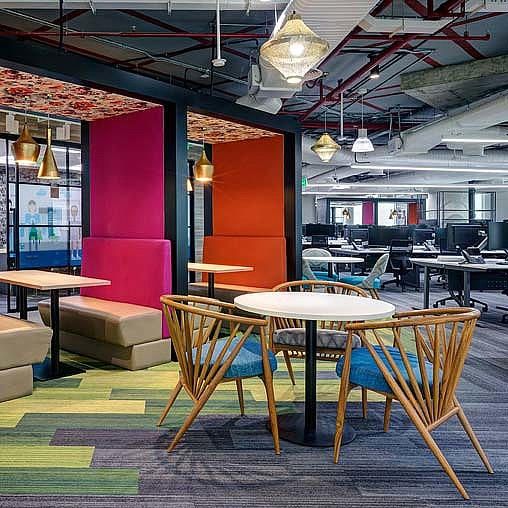 A room with tables and chairs.