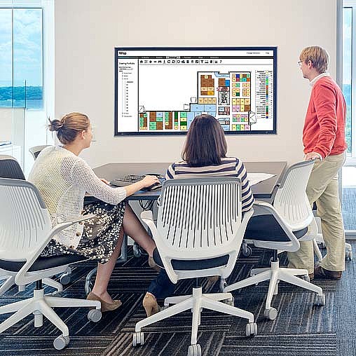 A group of people in a meeting.