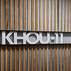 A sign on a wood surface.