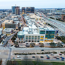 A large building with a parking lot in front of it.