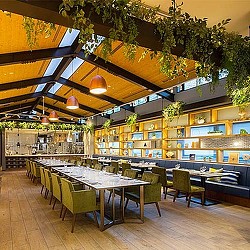 A restaurant with tables and chairs.