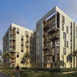 A person walking in front of a building.