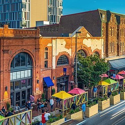 A group of people outside of a building.