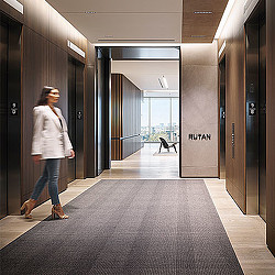 A man walking in a hallway.