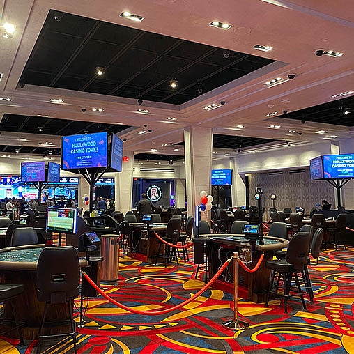 A room with many computers and chairs.