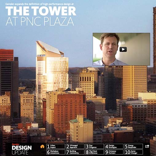 A man's face on a screen in front of a city.