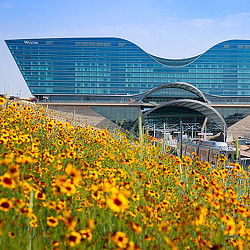 A large building with a bridge over it.