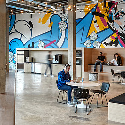 A group of people sitting at tables.