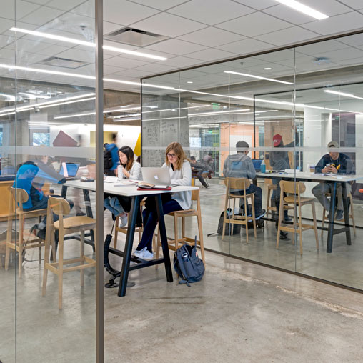 A group of people sitting at tables.