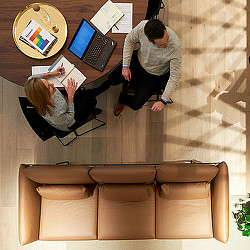 A group of people working on a laptop.