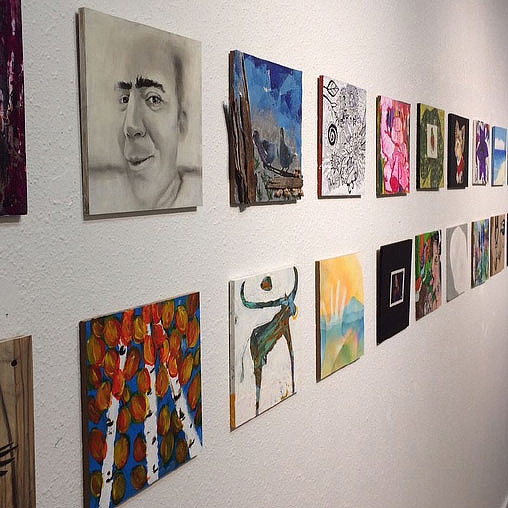 A wall with pictures on it.