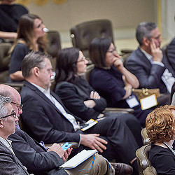 A group of people sitting in chairs.