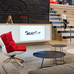 A woman and a man walking down a flight of stairs.