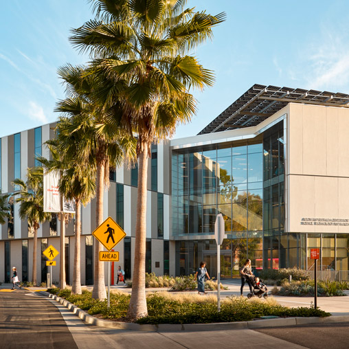 A building with palm trees.