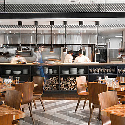 A couple of men in a restaurant.