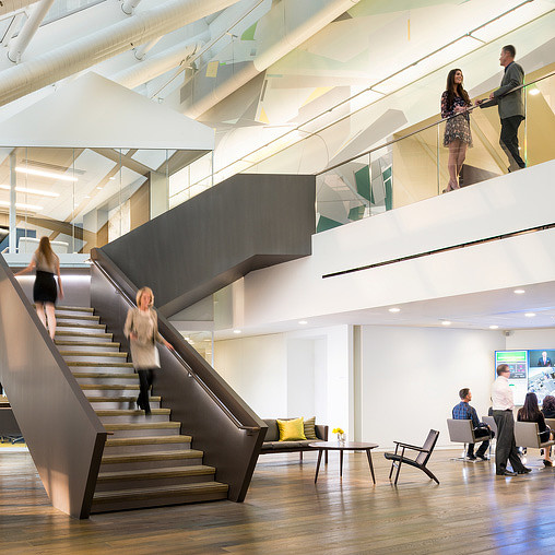 People walking up a staircase.
