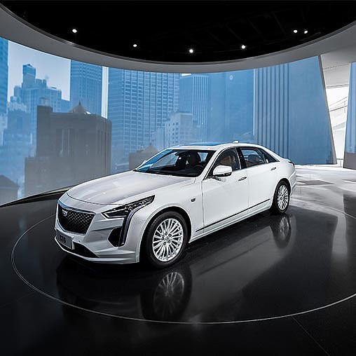A white car parked in a room.