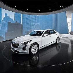 A white car parked in a room.