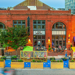 A building with a few people outside.