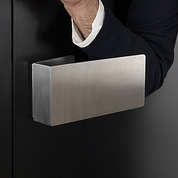 A hand holding a rectangular object.