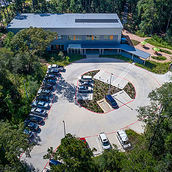 A building with a parking lot.