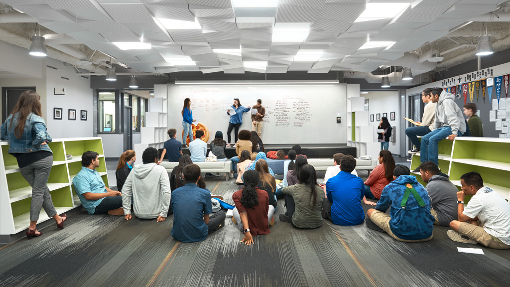 A group of people sitting in a room.