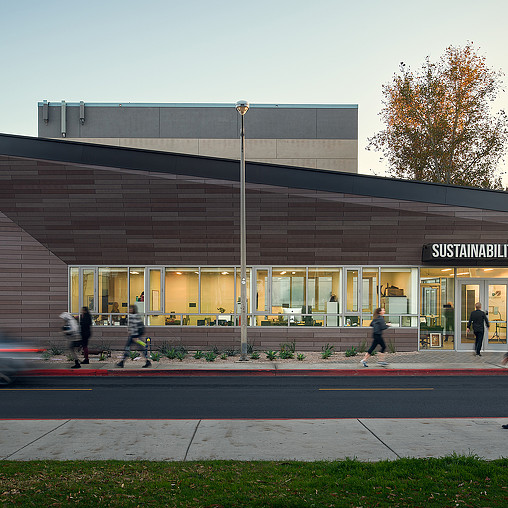 A building with people walking out front.