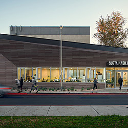 A building with people walking out front.