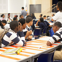 A group of people sitting at a table.