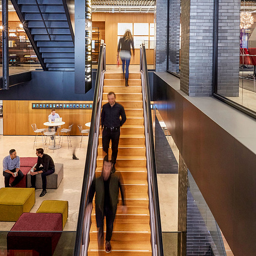 People walking down a flight of stairs.