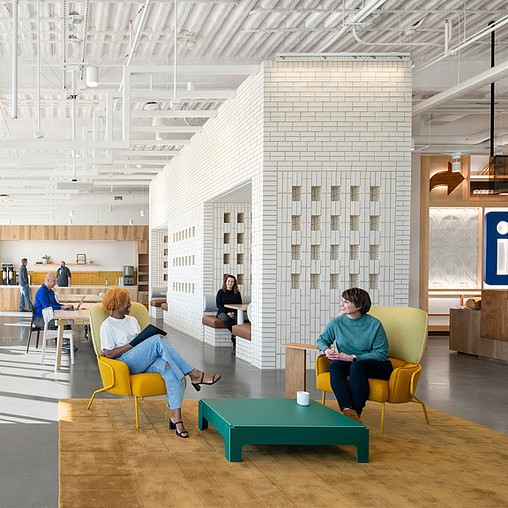 People sitting in chairs in a room.