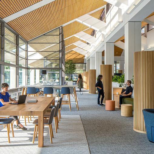 People sitting at tables in a building.