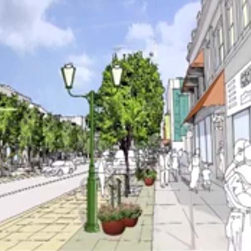 A street with trees and buildings.