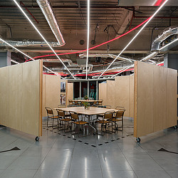 A room with a table and chairs.