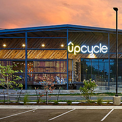 UPCycle building exterior at sunset
