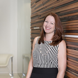 A woman smiling for the camera.