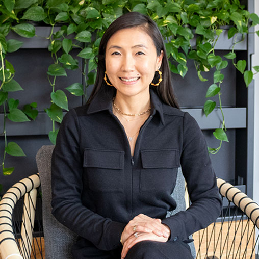 A woman sitting in a chair.
